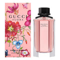 Gucci Flora perfume bottle and packaging with floral design on a pink background