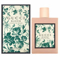Gucci Bloom perfume bottle and packaging with floral design on a white background
