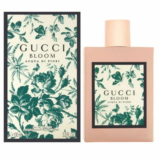 Gucci Bloom perfume bottle and packaging with floral design on a white background